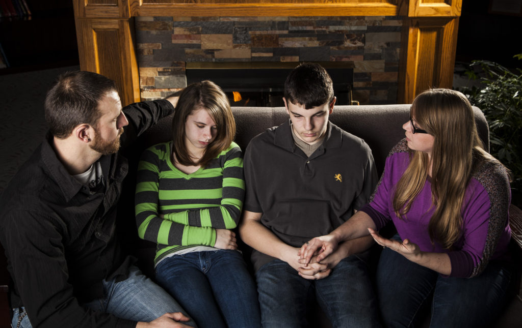 Teens grieve with family