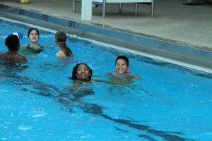Children swimming during Pathways Breakaway event.