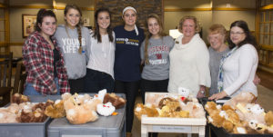 Oakwood High School students & Lasertoma group give stuffed teddy bears to patients at Ohio's Hospice of Dayton Hospice House.